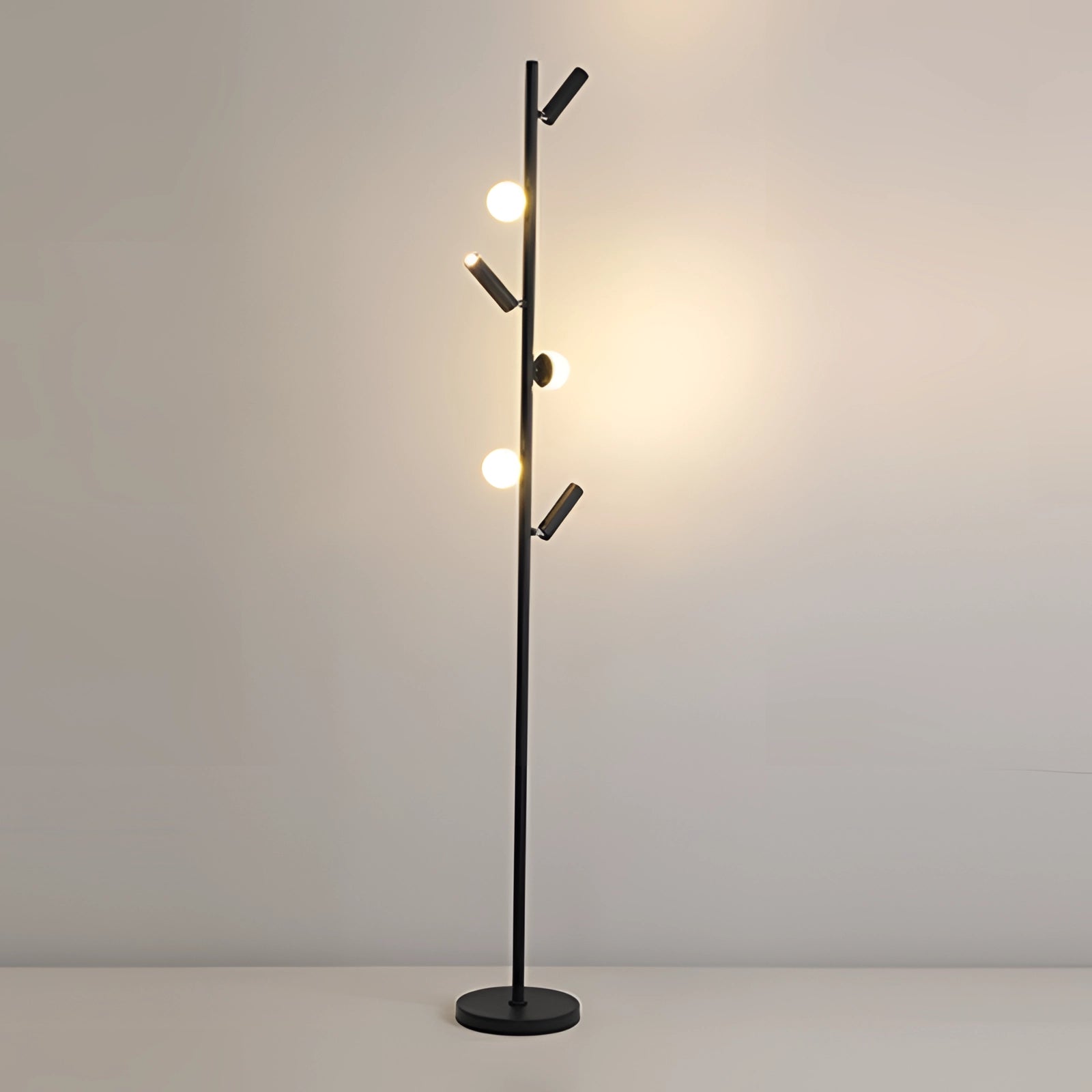 Modern black minimalist coat stand with six arms, featuring a textured black finish and illuminated by warm light, standing freestanding in a sleek design.
