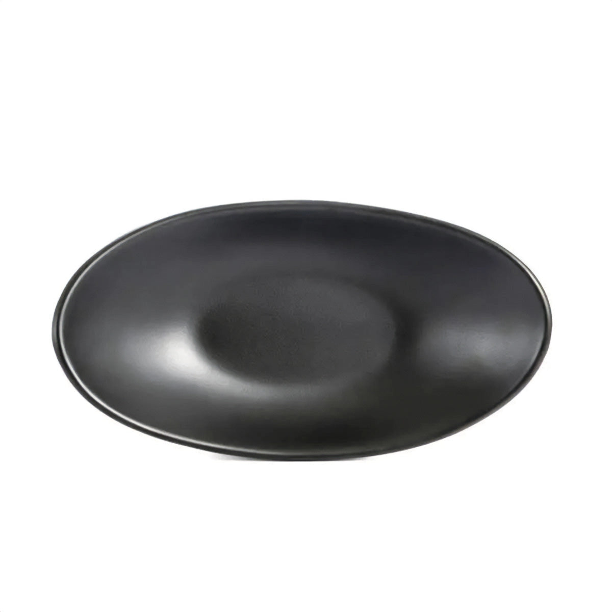 Minimalist black oval ceramic serving plates displayed on a table.