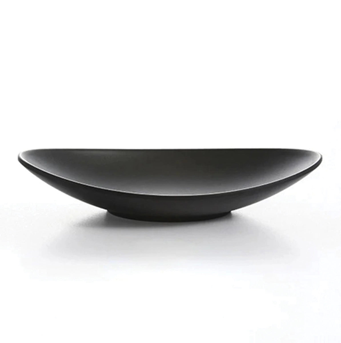 Black oval serving plate made of ceramic with a modern minimalist design, medium size, displayed in monochrome still life photography.