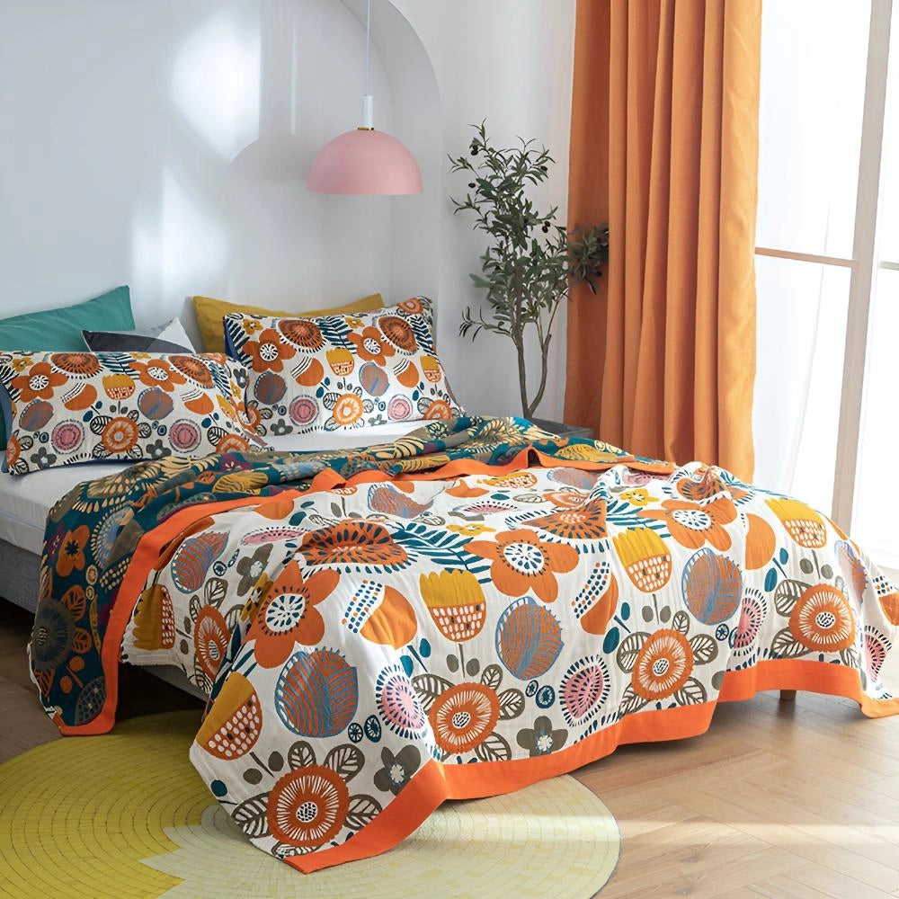 Bohemian Floral Comforter Set in a Super King size featuring an ethnic print bedding with vibrant orange hues, displayed on a bed in a well-decorated interior with modern furniture and a hint of greenery.