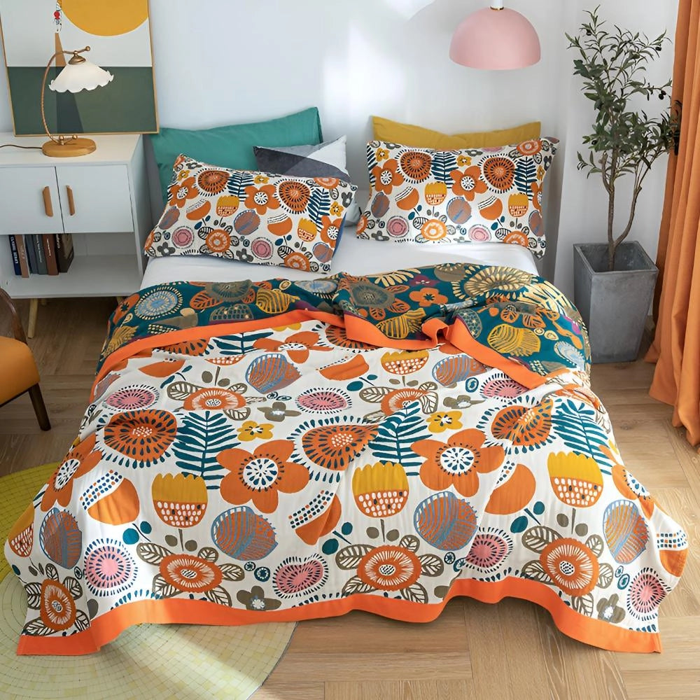 Bohemian floral comforter set featuring an ethnic print in shades of blue, green, and orange, styled on a queen-size bed, enhancing the cozy and vibrant interior design of the bedroom.