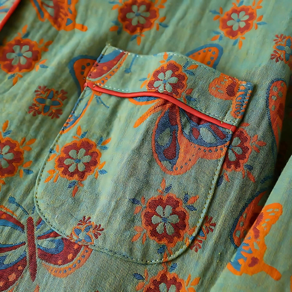 Bohemian floral print women's pants with a turquoise paisley pattern, featuring a vibrant mix of aqua and magenta hues.