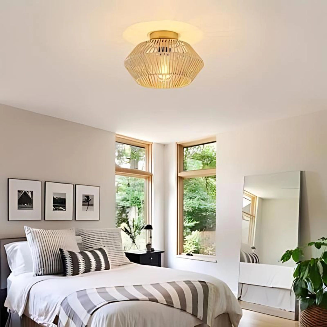 Bohemian wicker ceiling light featuring a natural fiber basket weave design, hanging in a cozy interior space with houseplants and wooden furniture, casting a warm, inviting glow.