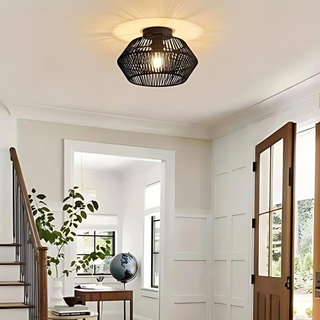 Bohemian wicker ceiling light with a natural fiber basket weave design, hanging in a stylishly decorated interior space with wooden elements and natural lighting, enhancing the cozy ambiance.