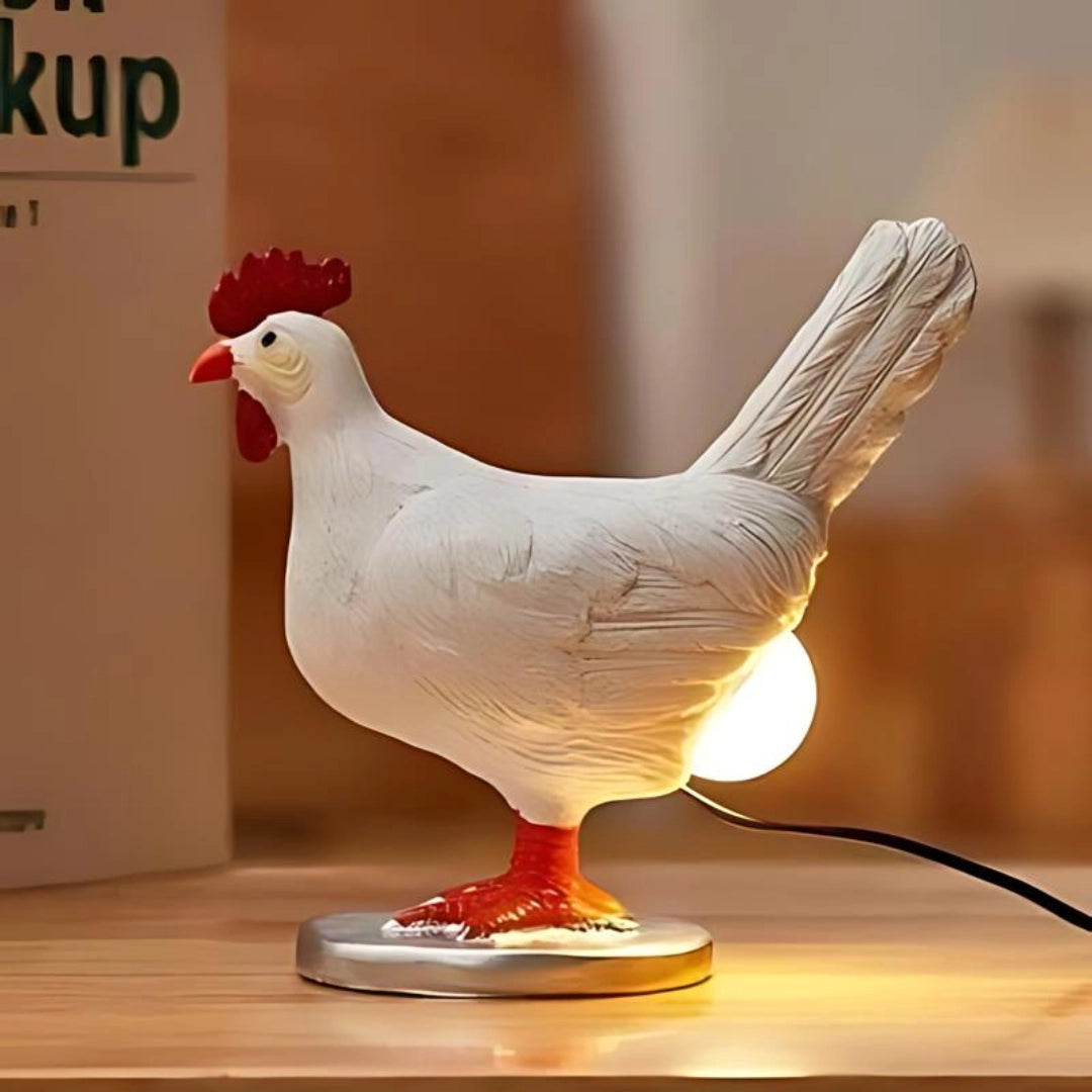 Chicken-shaped rustic rooster table lamp with detailed features, including a prominent comb and beak, designed in a farmhouse decor style, resembling a wooden sculpture of a chicken.