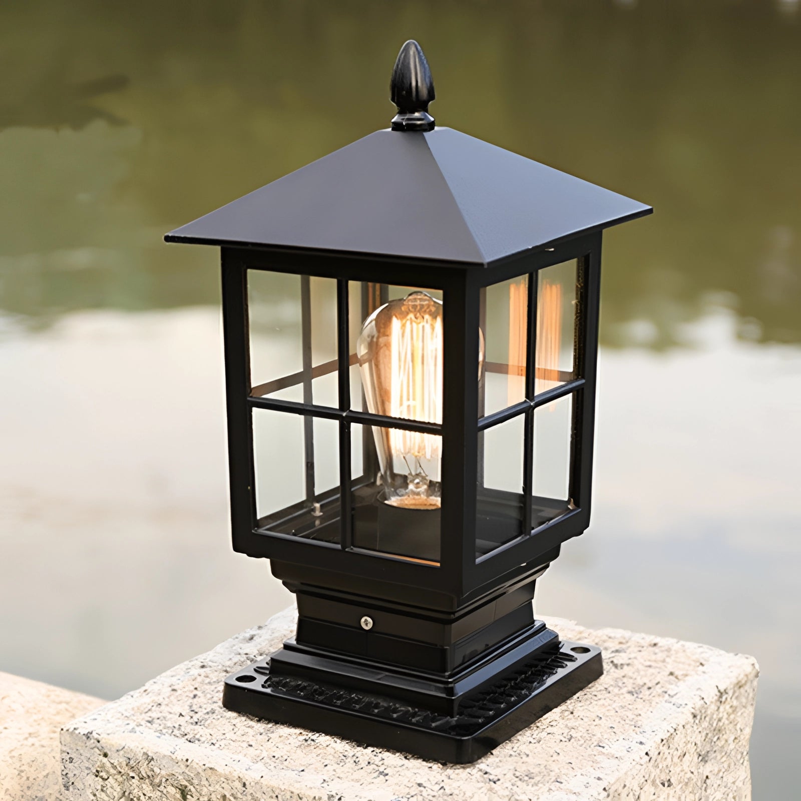 Classic vintage-style metal lantern with a weather-resistant design, featuring a rectangular glass enclosure and metal frame, suitable for outdoor lighting.