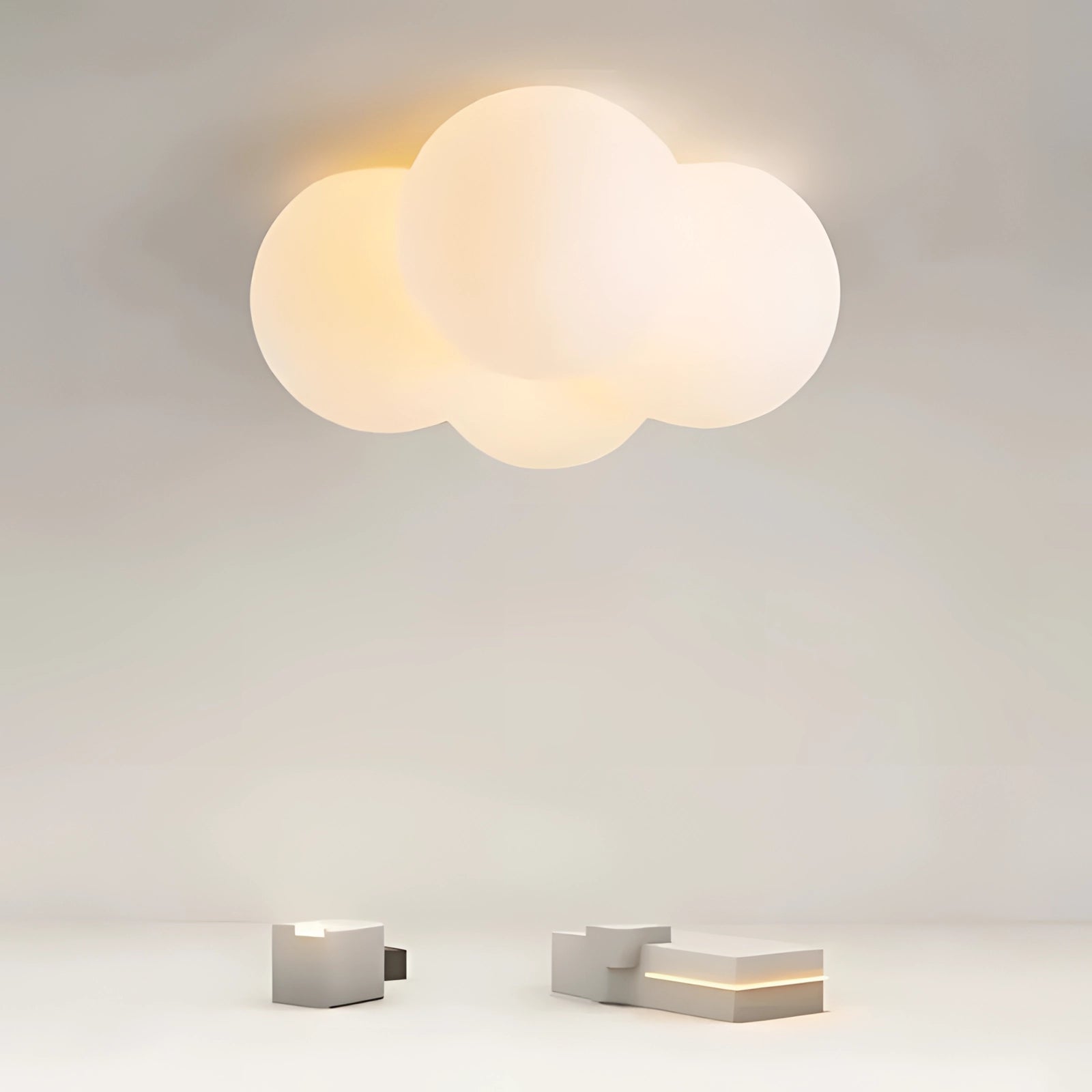 Cloud-shaped LED ceiling light with a modern minimalist design, featuring ambient lighting and a sleek appearance. The fixture resembles a cloud with soft contours and a subtle glow, creating a tranquil atmosphere.