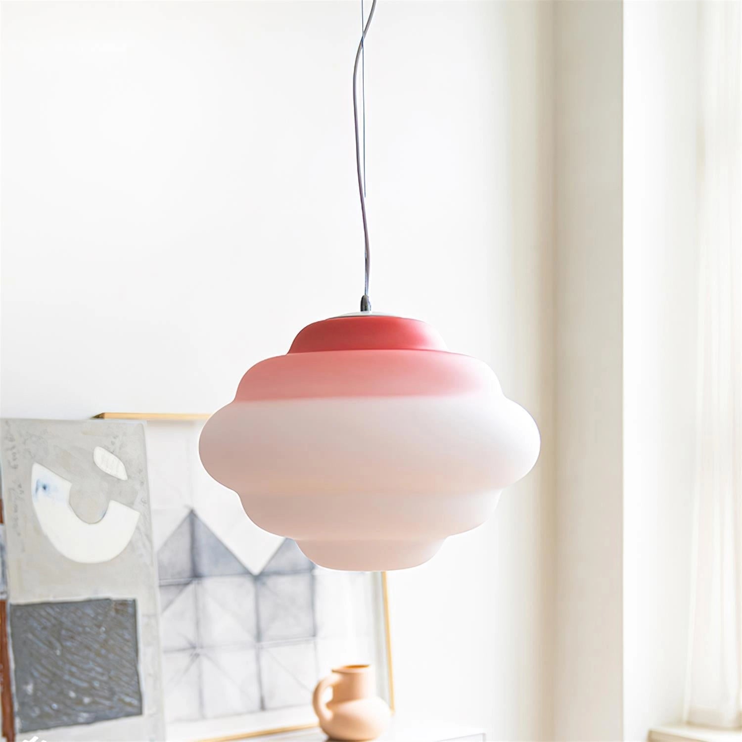 Cloud-shaped LED pendant lights with wooden accents hanging from the ceiling, designed as decorative lighting for nurseries and living rooms.