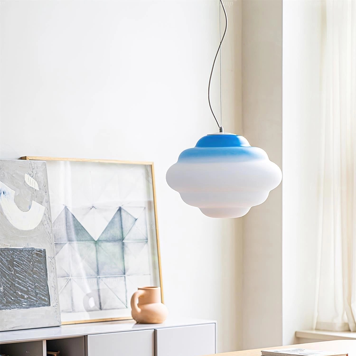 Cloud-Shaped LED Pendant Lights hanging from the ceiling in a nursery room, with wooden shelving and wall decor in the background.