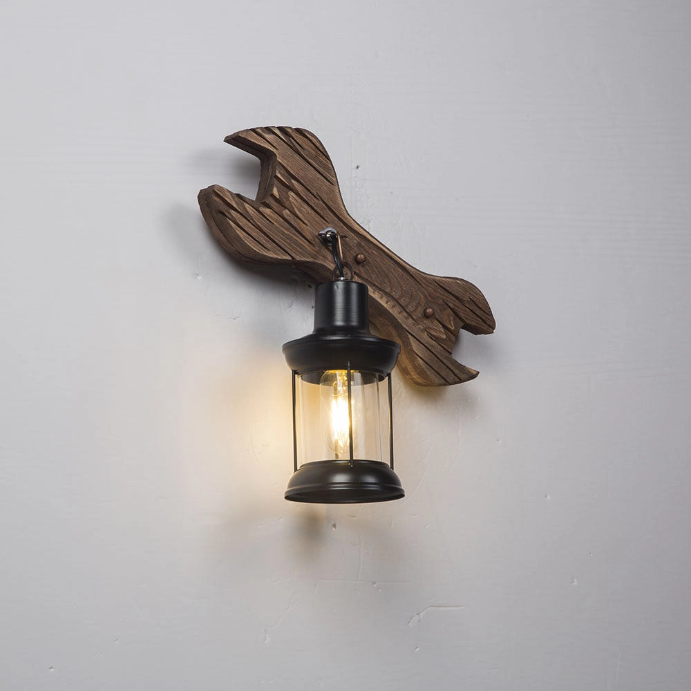 Coastal Whale Wall Sconce with a rustic nautical design, featuring a whale motif crafted from wood and metal elements, including bronze and brass accents, creating an ocean-themed decor light.