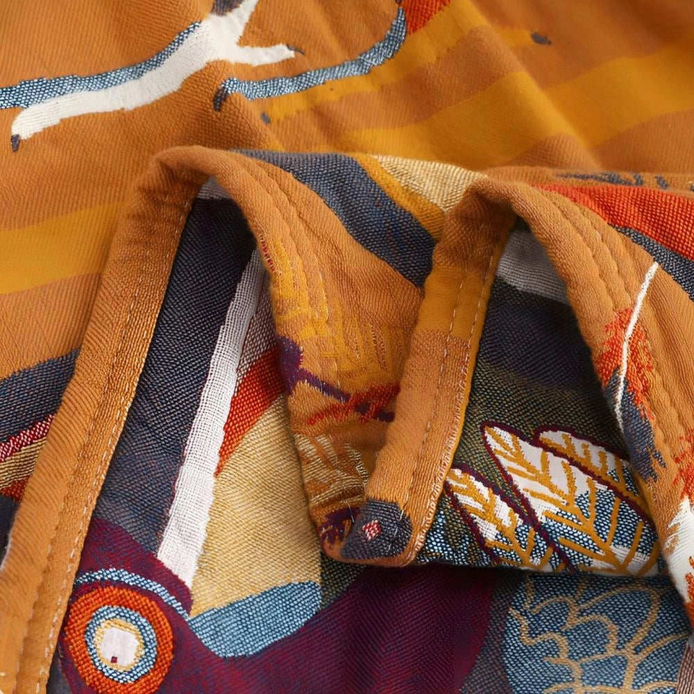 A colorful bird-themed duvet cover featuring an artistic wildlife design with vibrant gold and electric blue patterns, showcasing intricate textile details.