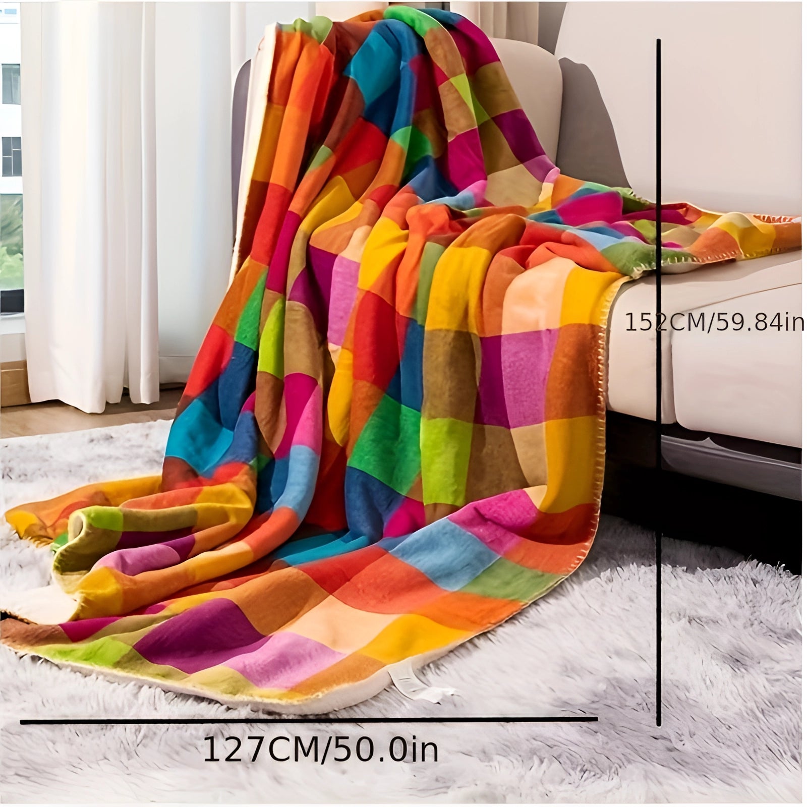 Colorful geometric throw blanket draped over an orange chair, showcasing a vibrant artistic design with magenta and orange patterns.