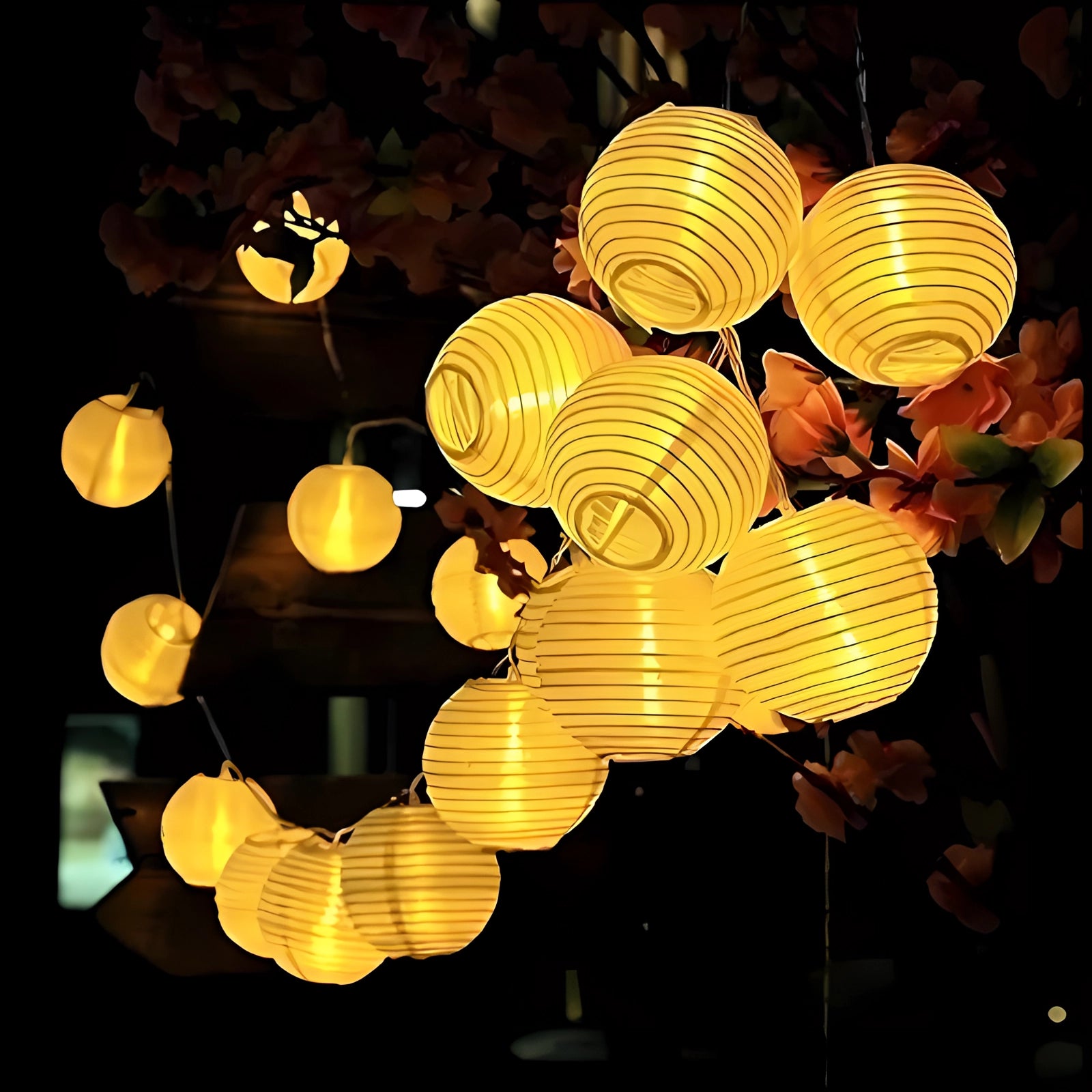 Colorful LED outdoor string lights with yellow lanterns, featuring a symmetrical pattern of 30 circular LED lamps hanging in a 6.5-meter length, emitting a warm amber glow ideal for evening events.