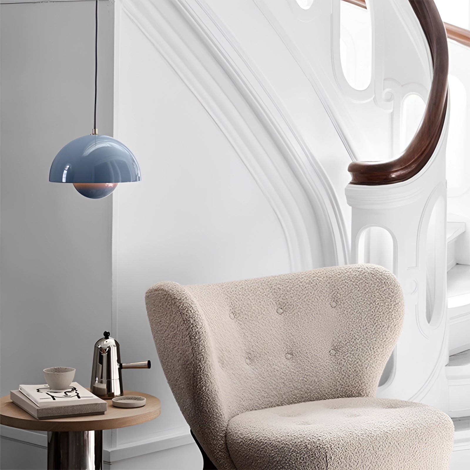 Modern dining room featuring colorful pendant lights, white and grey furniture, and Scandinavian retro decor elements.