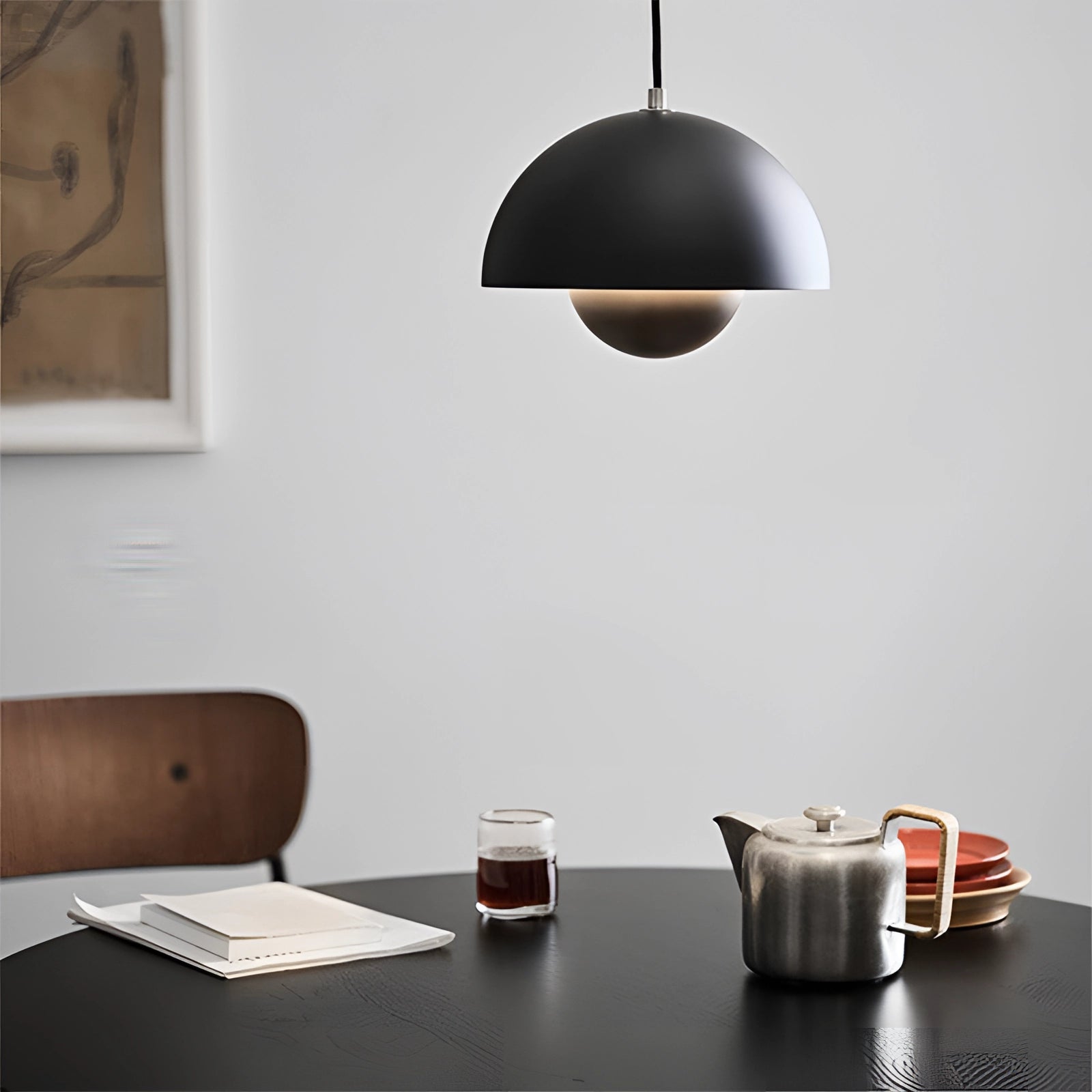 Modern dining room with colorful pendant lights, wooden table set with tableware and drinkware, Scandinavian decor style.