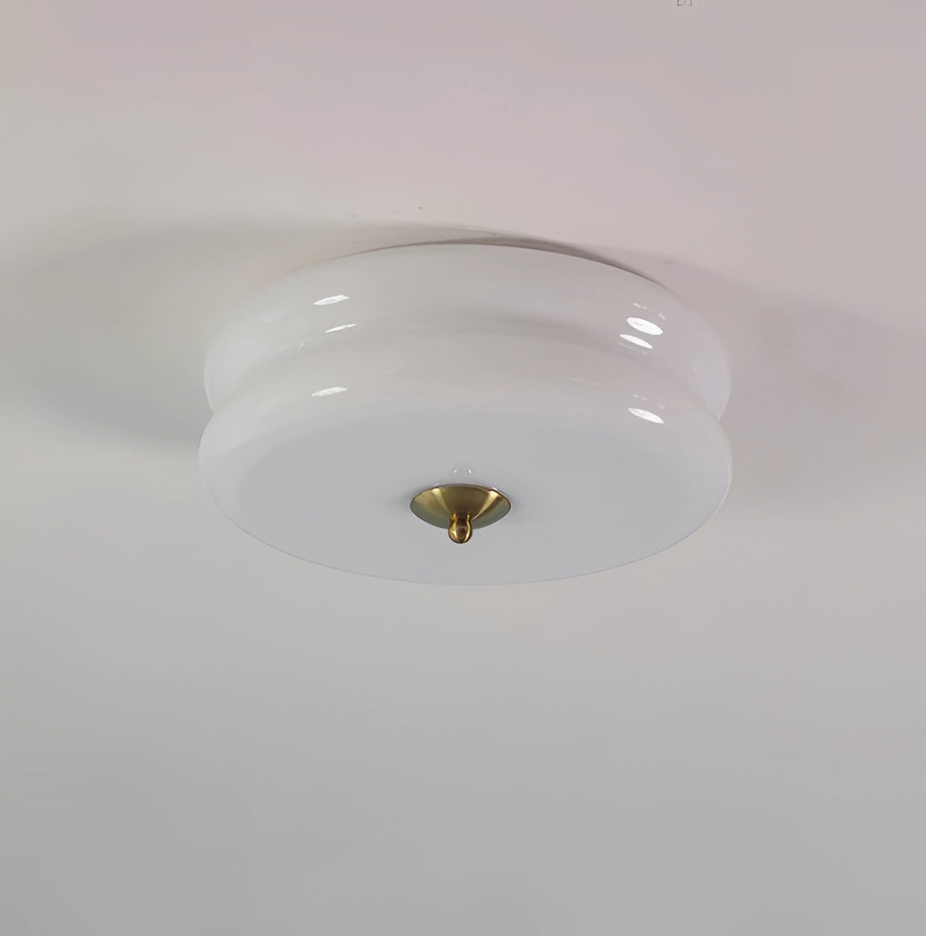 Modern cream ceiling lamp with frosted glass design, featuring a circular shape with gold and white accents, measuring 40cm in diameter and 13cm in height, ideal for enhancing home decor.