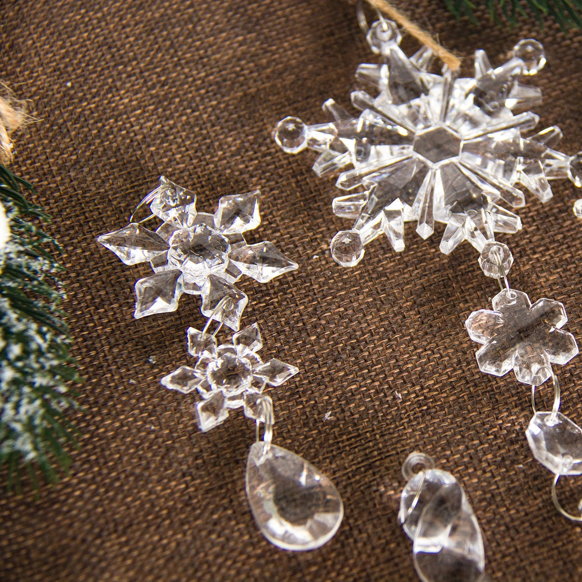 Crystal snowflake ornaments with luxury glass design featuring intricate silver embellishments and artistic detailing, suitable for elegant Christmas decor.