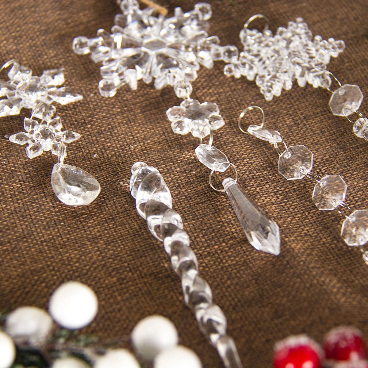 Crystal snowflake ornaments made of luxury glass, elegantly designed for Christmas decor with a shimmering silver finish.