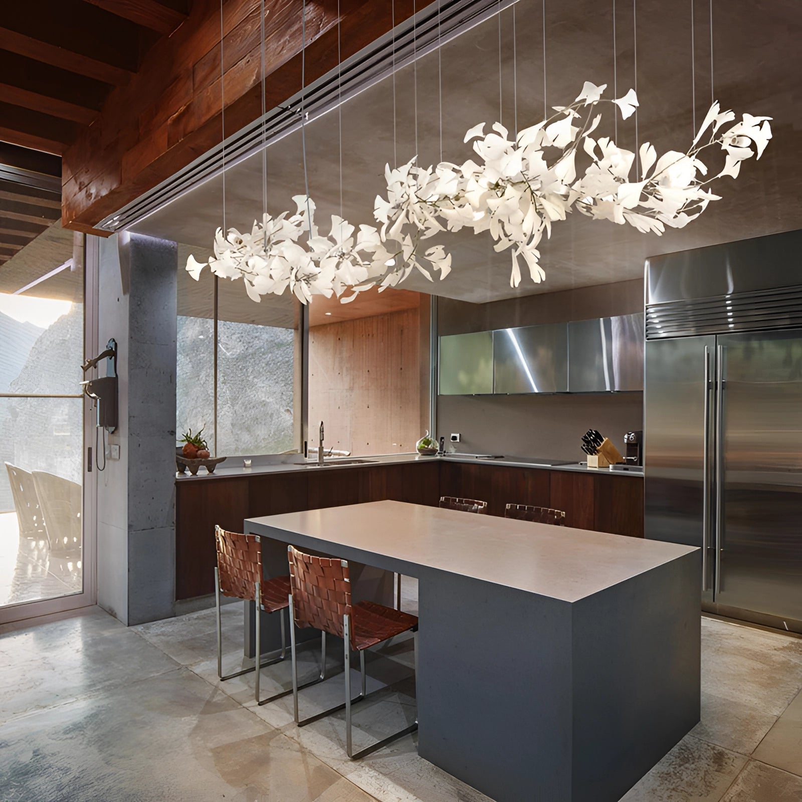 Modern luxury kitchen interior featuring a 60CM Designer Ginkgo Leaf LED Chandelier hanging above a sleek table, with cabinetry and wood flooring enhancing the sophisticated ambience.