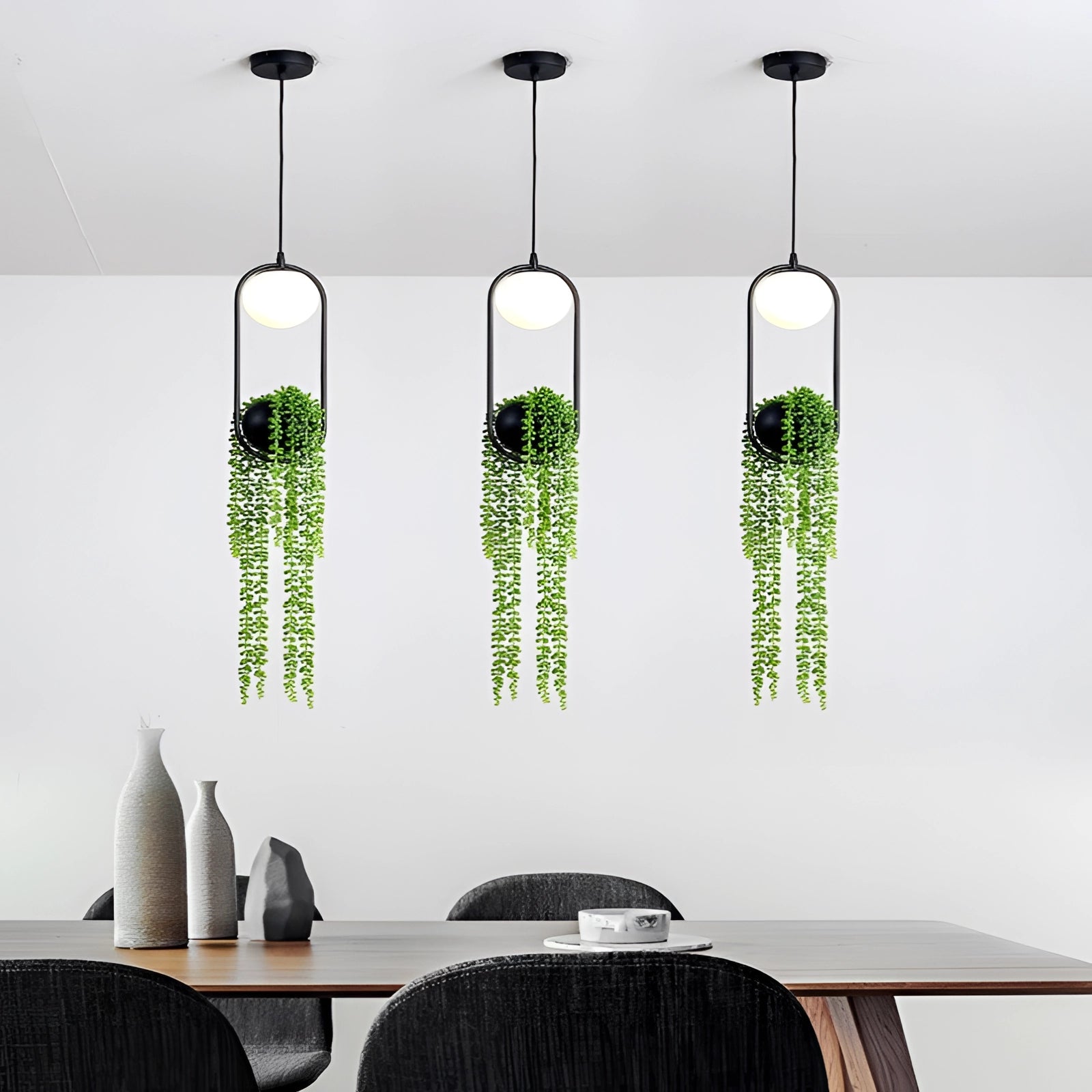 Eco-friendly Scandinavian pendant light fixture featuring a modern design with plant elements, stylishly illuminating an interior space.