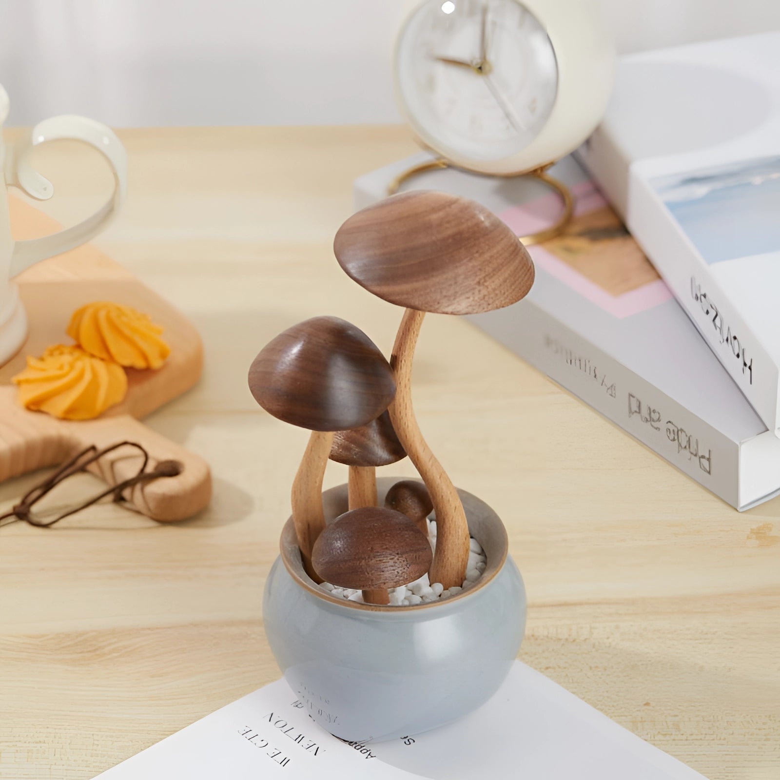 Eco-friendly wooden mushroom sculpture in a ceramic pot, showcasing natural materials and artistic design, with a focus on balance and creativity.