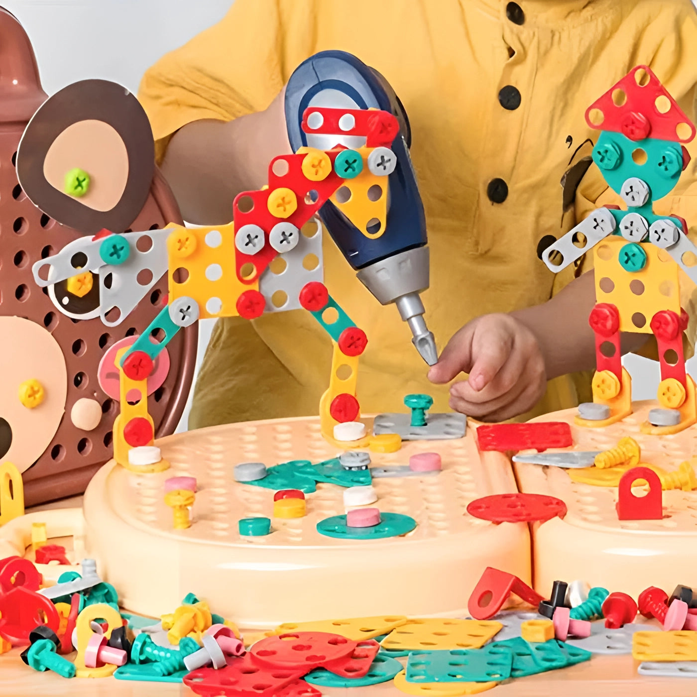 A colorful 204-piece electric drill toy set for kids, featuring various construction pieces and tools designed for STEM learning and creative play.