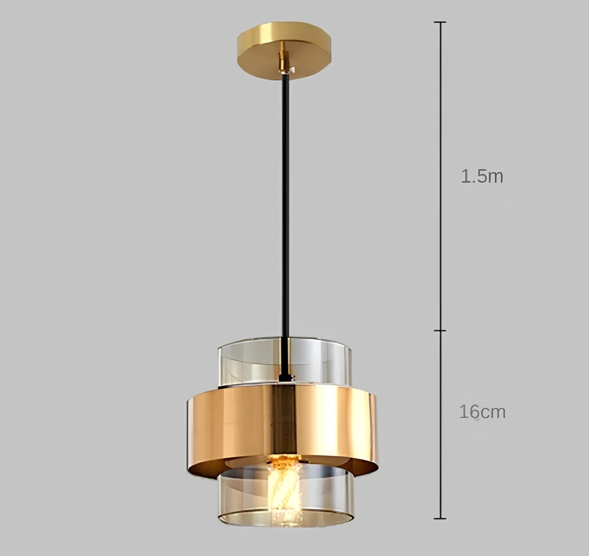 Elegant gold-brass pendant chandelier with an amber cylindrical shade, featuring an adjustable ceiling mount for interior design.