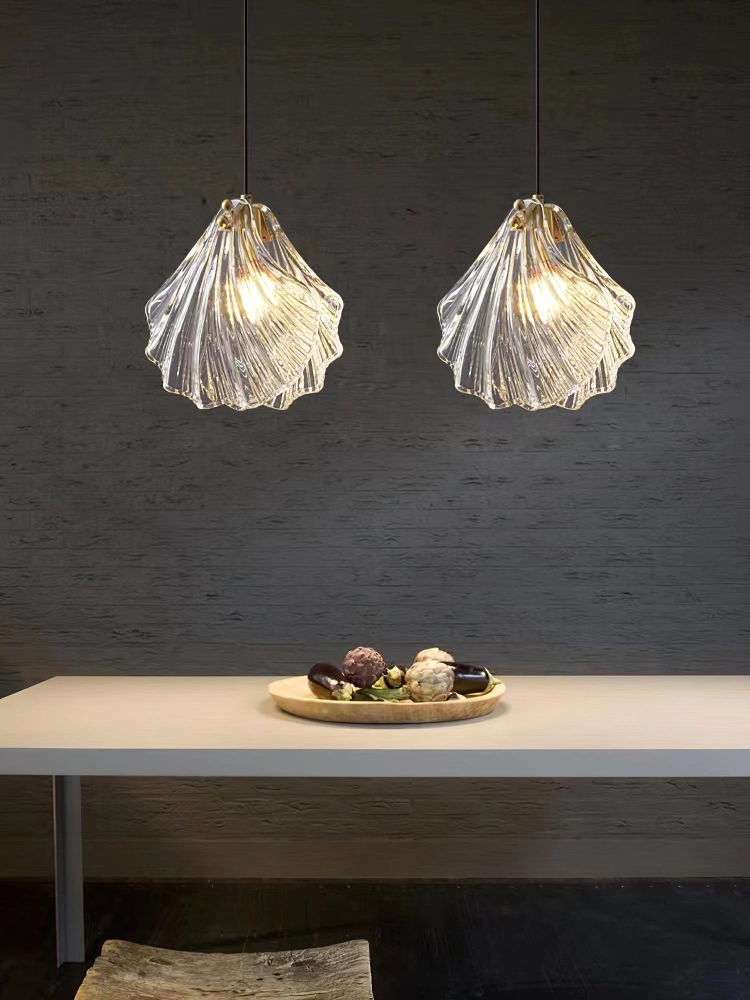 Elegant Petal Glass Pendant Light - Modern LED Floral Chandelier illuminating a dining table set with seafood platter.