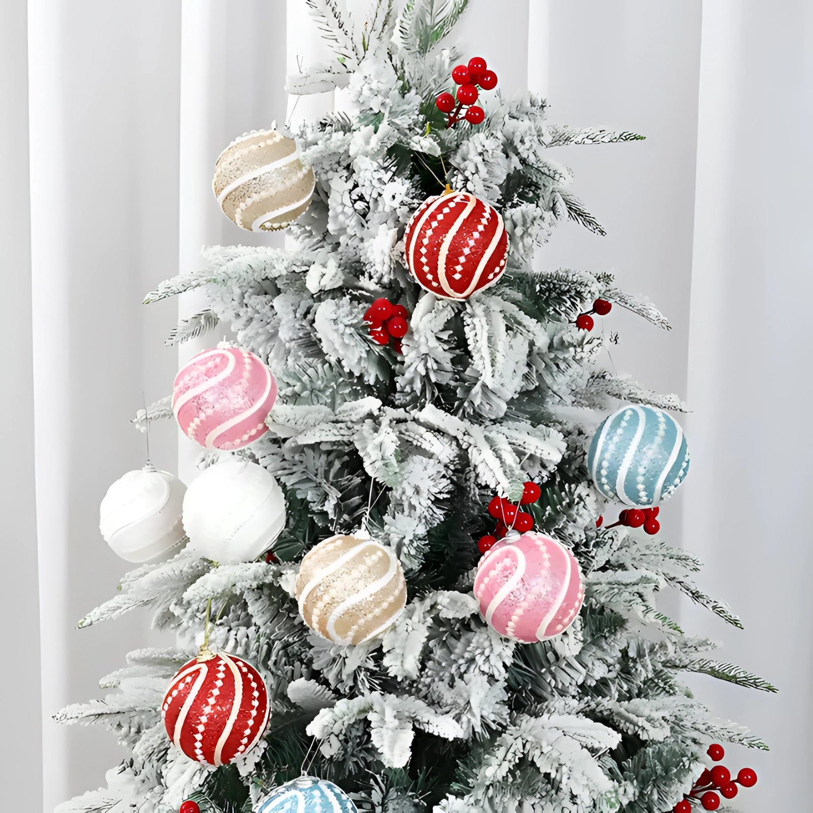 Elegant silver sequin Christmas ornament hanging from an evergreen branch on a Christmas tree, showcasing its glittery and festive appearance.