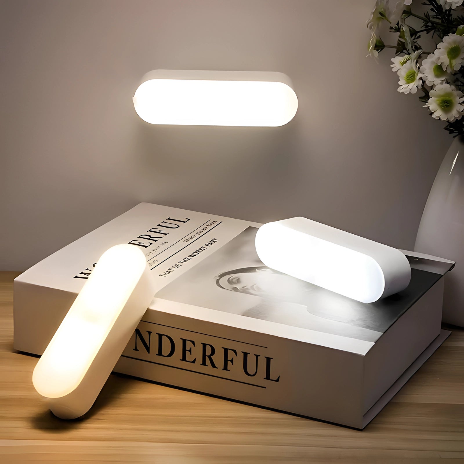 Energy-efficient adjustable LED reading light with motion sensor attached to a rectangular wooden base, positioned in a well-lit room.