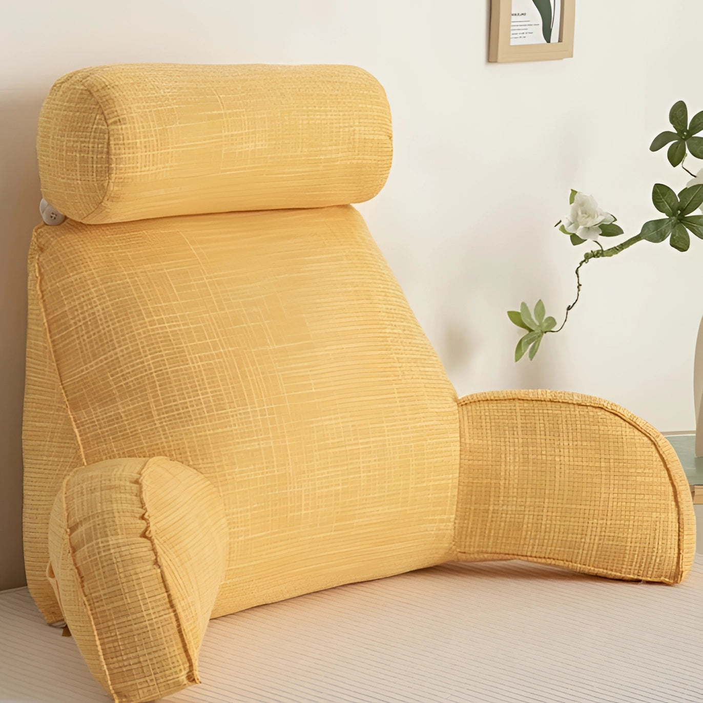 Yellow ergonomic adjustable linen recliner chair with arm support, featuring a wooden frame and beige upholstery set in a modern interior design.