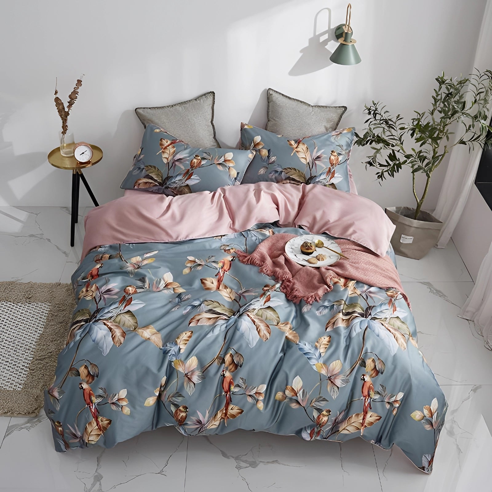 Luxurious floral botanical comforter set featuring a vibrant butterfly design displayed on a neatly made bed with a sturdy bed frame, complemented by soft azure accents and surrounded by a cozy, well-lit room.