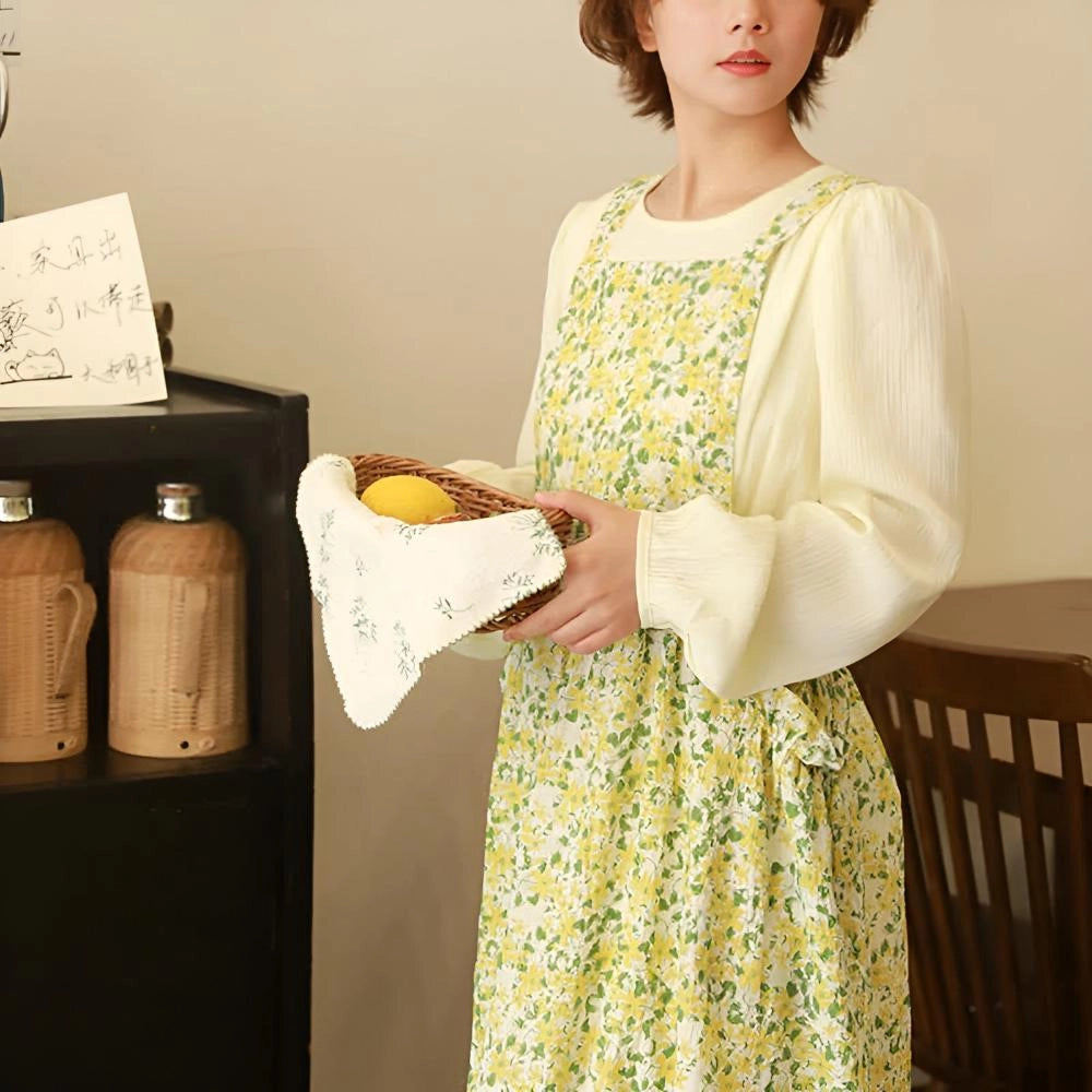 Yellow floral cotton apron for women featuring a vintage design with pockets.