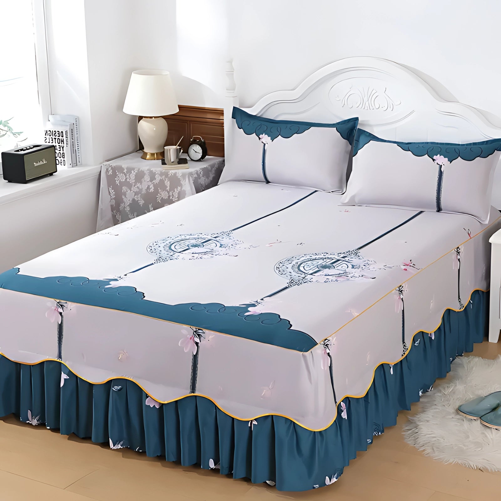 Floral luxury ice silk bedding set with a ruffled skirt and pillowcase displayed on a bed, featuring a blue floral pattern on the silky fabric, adding elegance and comfort to the bedroom interior.