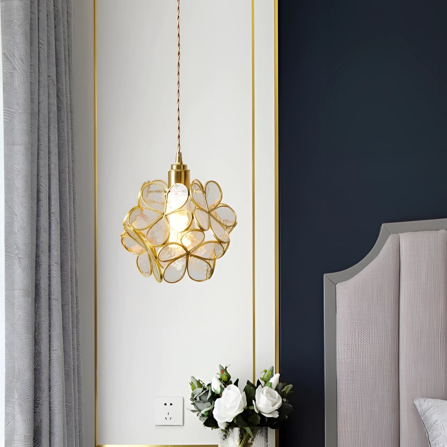 Elegant floral pendant light in a modern interior setting, featuring a blossom design.