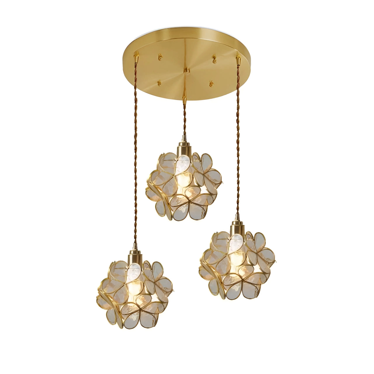 Modern floral pendant light with a clear triple blossom design, featuring glass shades, hanging from the ceiling, illuminating a stylish and contemporary room.