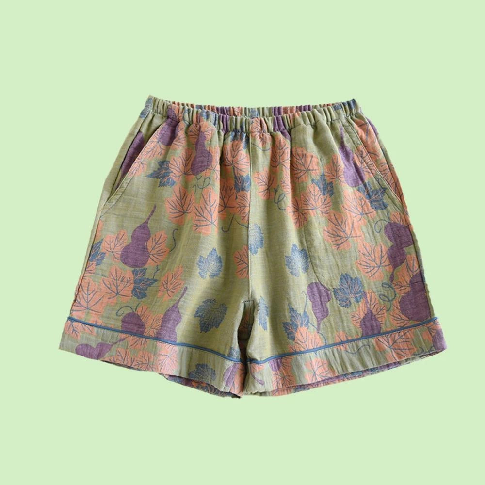 Green floral print pants featuring a ginkgo leaf pattern with an elastic waistband, suitable for an XL size.