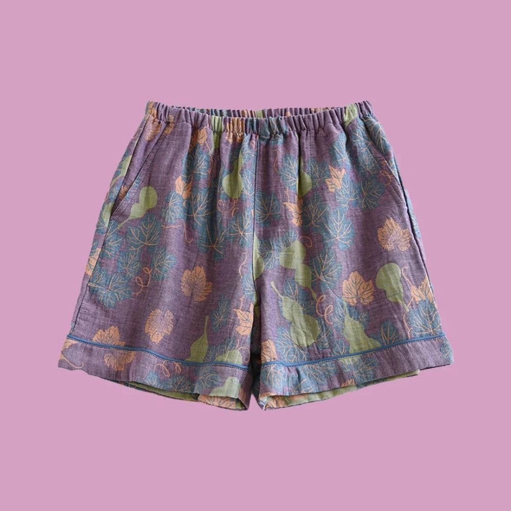 Purple floral print pants featuring a ginkgo leaf pattern with an elastic waistband, size XL.