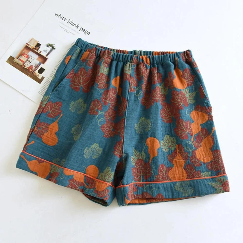 Floral print pants featuring a ginkgo leaf pattern, elastic waistband, and a dark blue color in XL size.