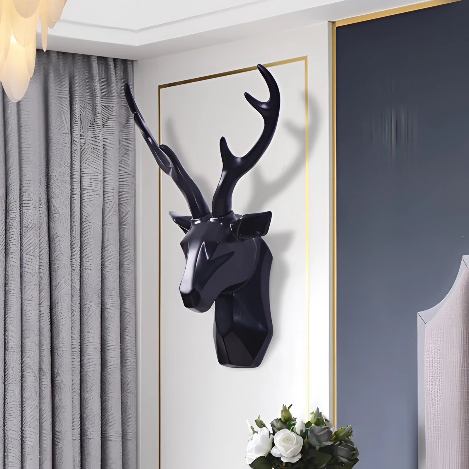 Gold geometric deer head art piece mounted on a white background, showcasing intricate horn details and a modern stag design.