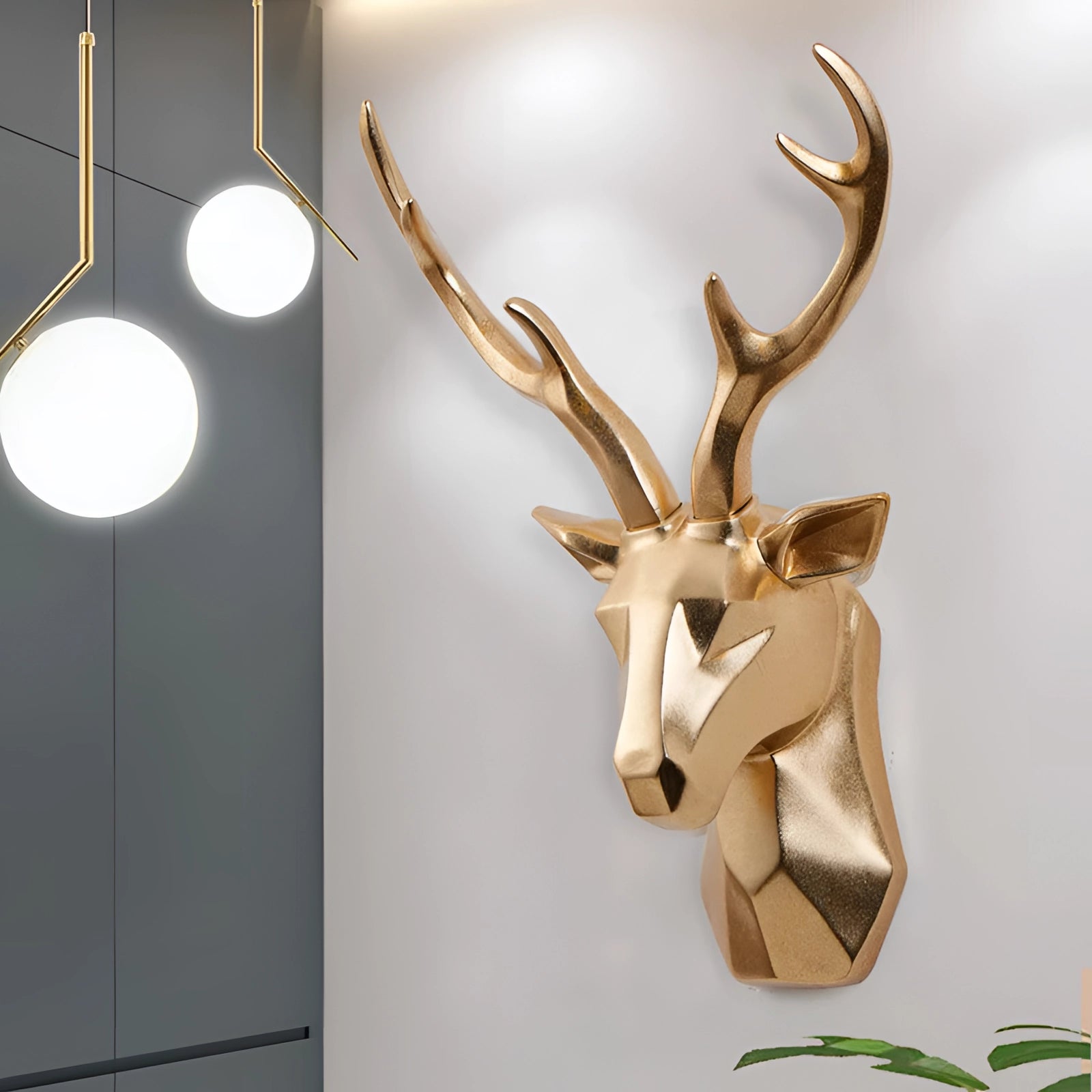 Gold geometric deer head art piece with intricate 3D design, featuring prominent antlers and a modern artistic style.