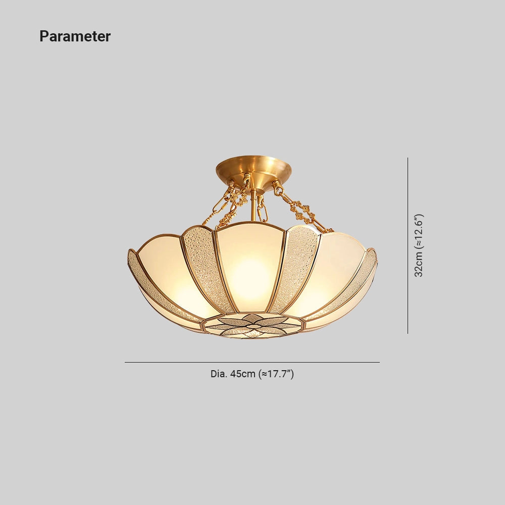 Gold Art Deco semi-flush ceiling light featuring frosted glass with an ornate design, resembling jewelry and ornamentation, in an oval shape.