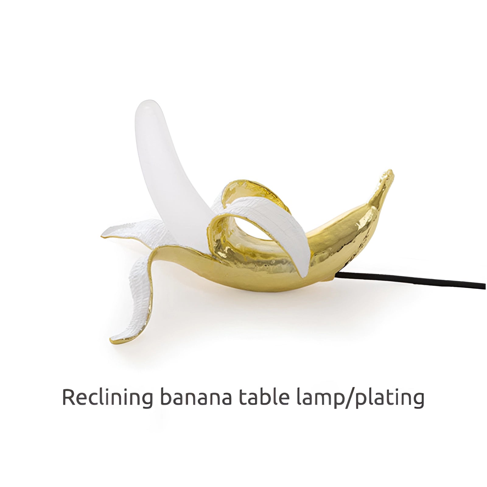 Gold banana-shaped resin table lamp designed as a modern art sculpture; features a unique and artistic representation of fruit with a metallic finish, suitable for contemporary home decor.