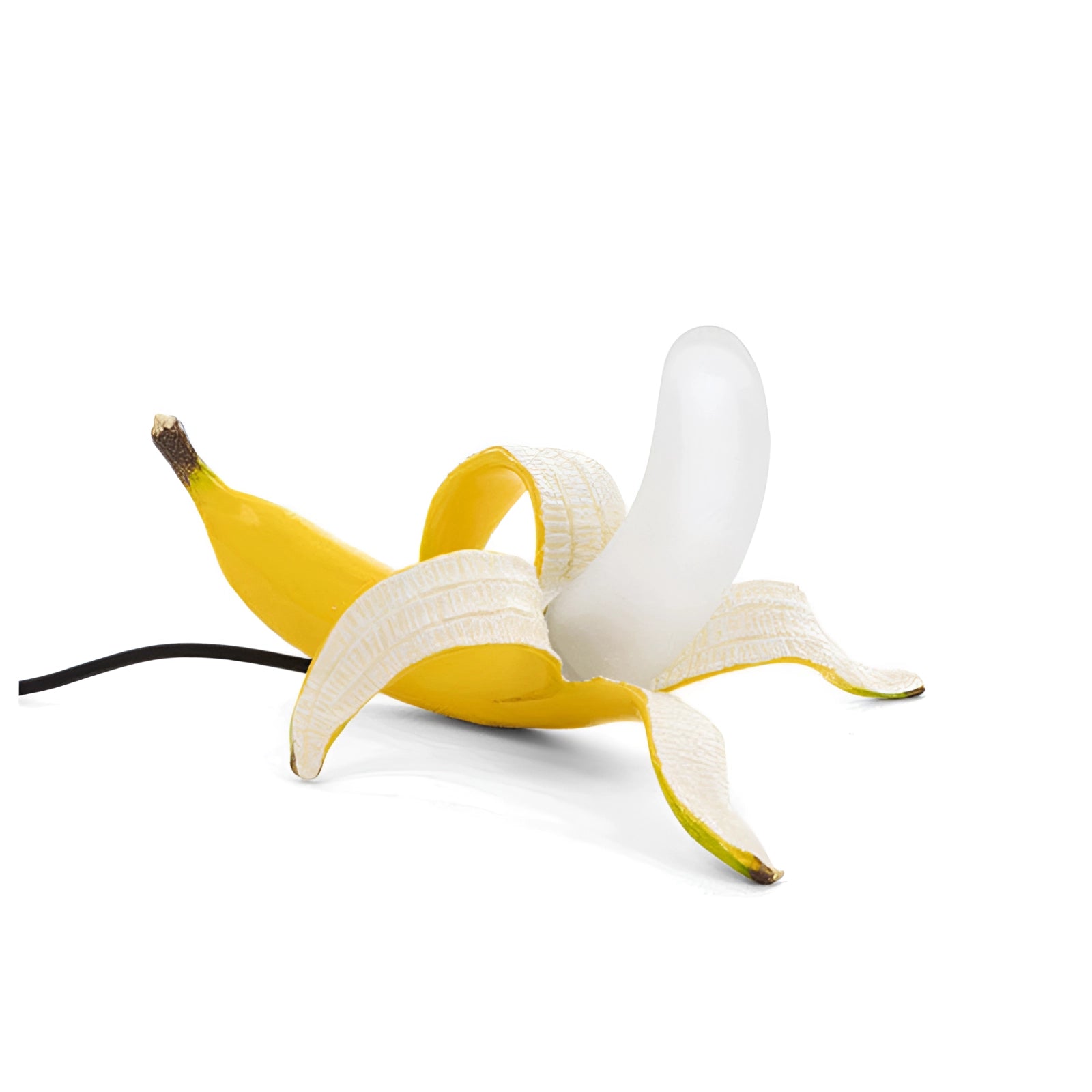 Gold banana resin table lamp in a lying position with a vibrant yellow finish, designed as a modern art fruit sculpture decor piece.