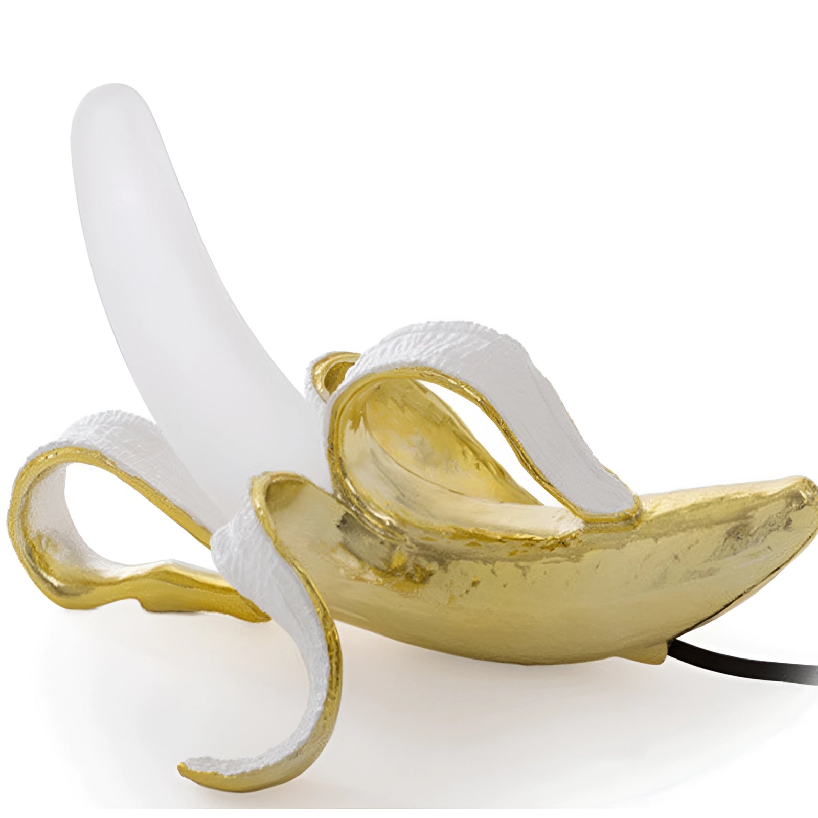Gold banana-shaped resin table lamp designed as a modern art fruit sculpture, featuring a glossy finish and contemporary style suitable for decorative home settings.