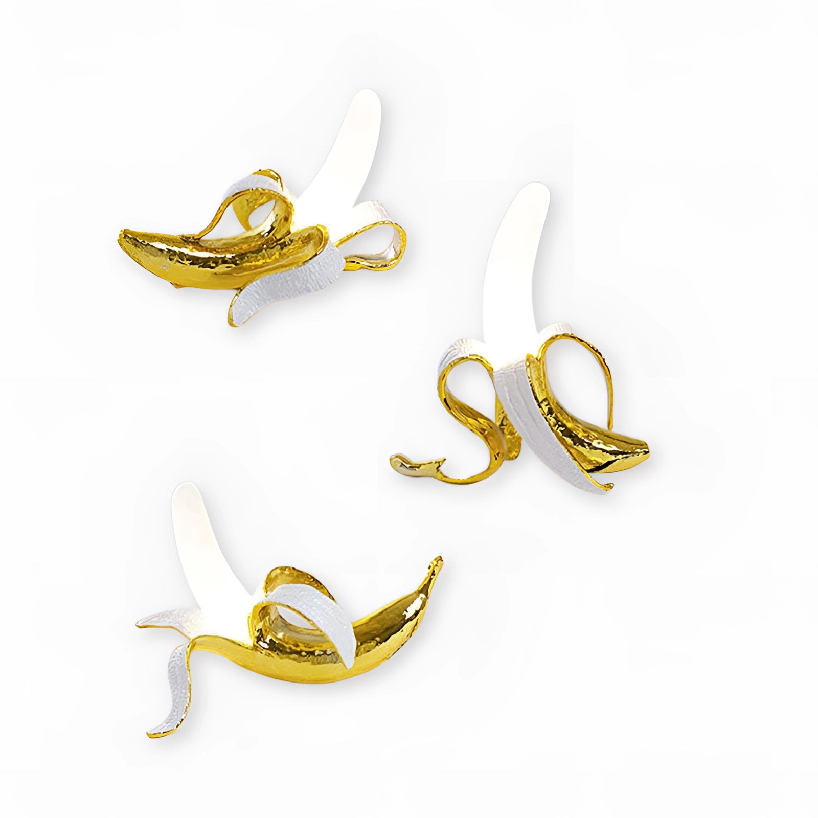 Gold Banana Resin Table Lamp resembling a modern art fruit sculpture, featuring a sleek design with a metallic finish.