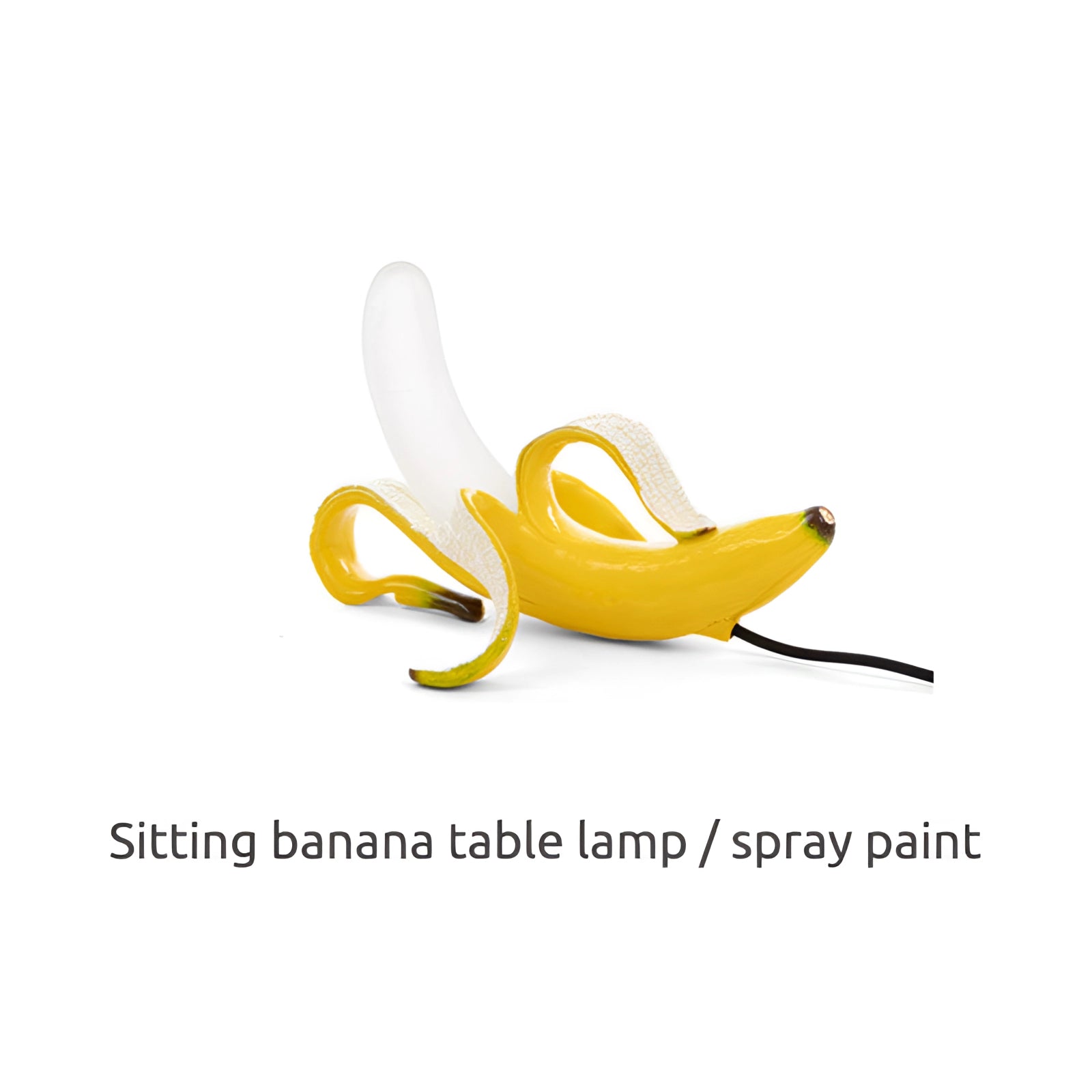 A stylish gold banana-shaped resin table lamp designed as a modern art fruit sculpture, showcasing a whimsical and artistic gesture with a sleek, glossy finish.