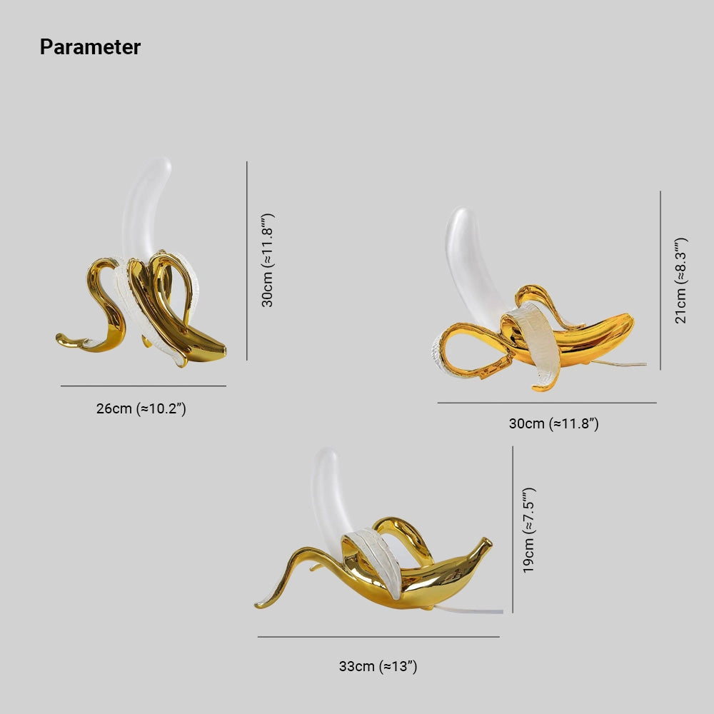 Gold Banana Resin Table Lamp with a unique modern art fruit sculpture design, featuring a glossy finish and contemporary aesthetic.