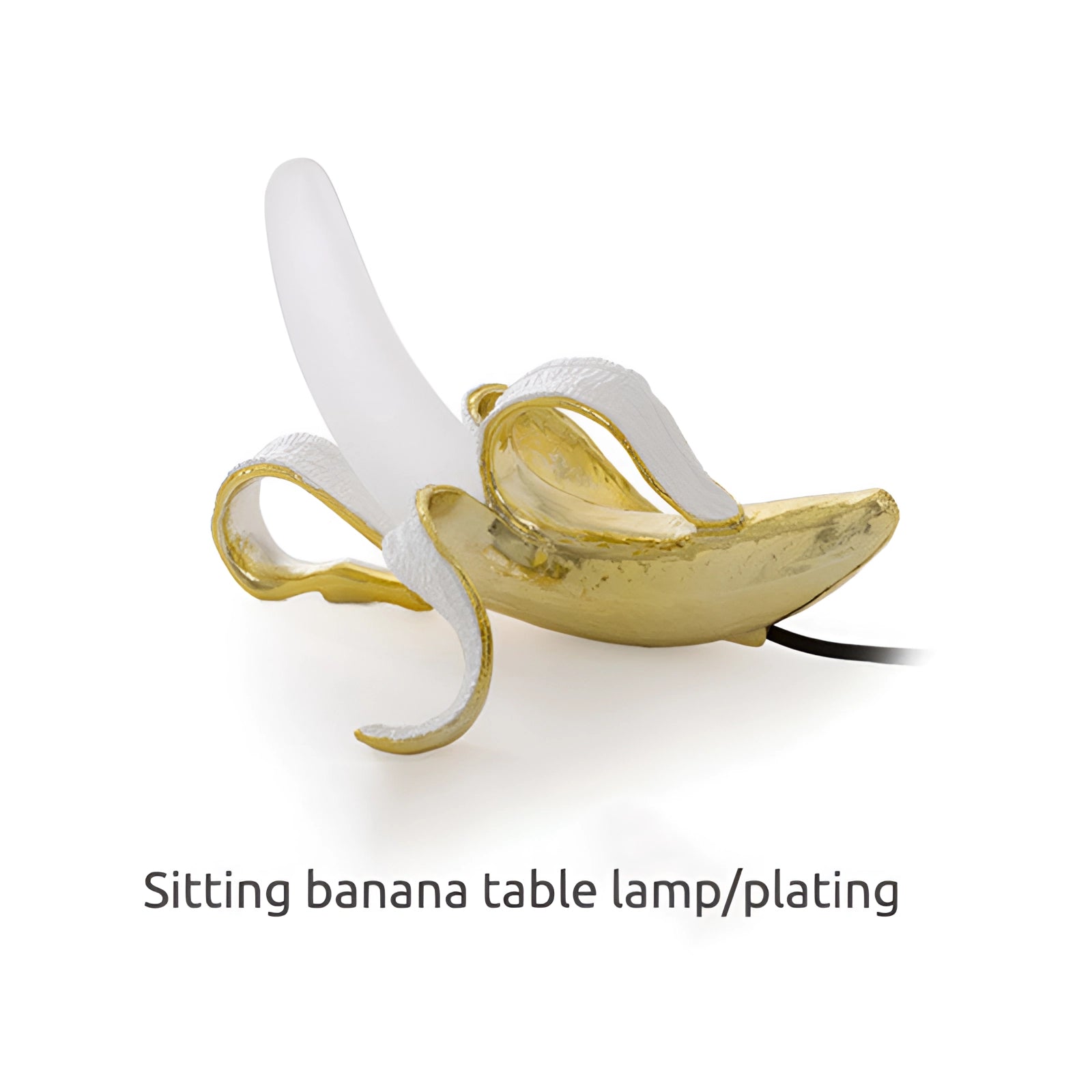 Gold Banana Resin Table Lamp featuring a modern art fruit sculpture design, crafted with a metallic finish resembling bronze or brass, ideal for unique home decor.