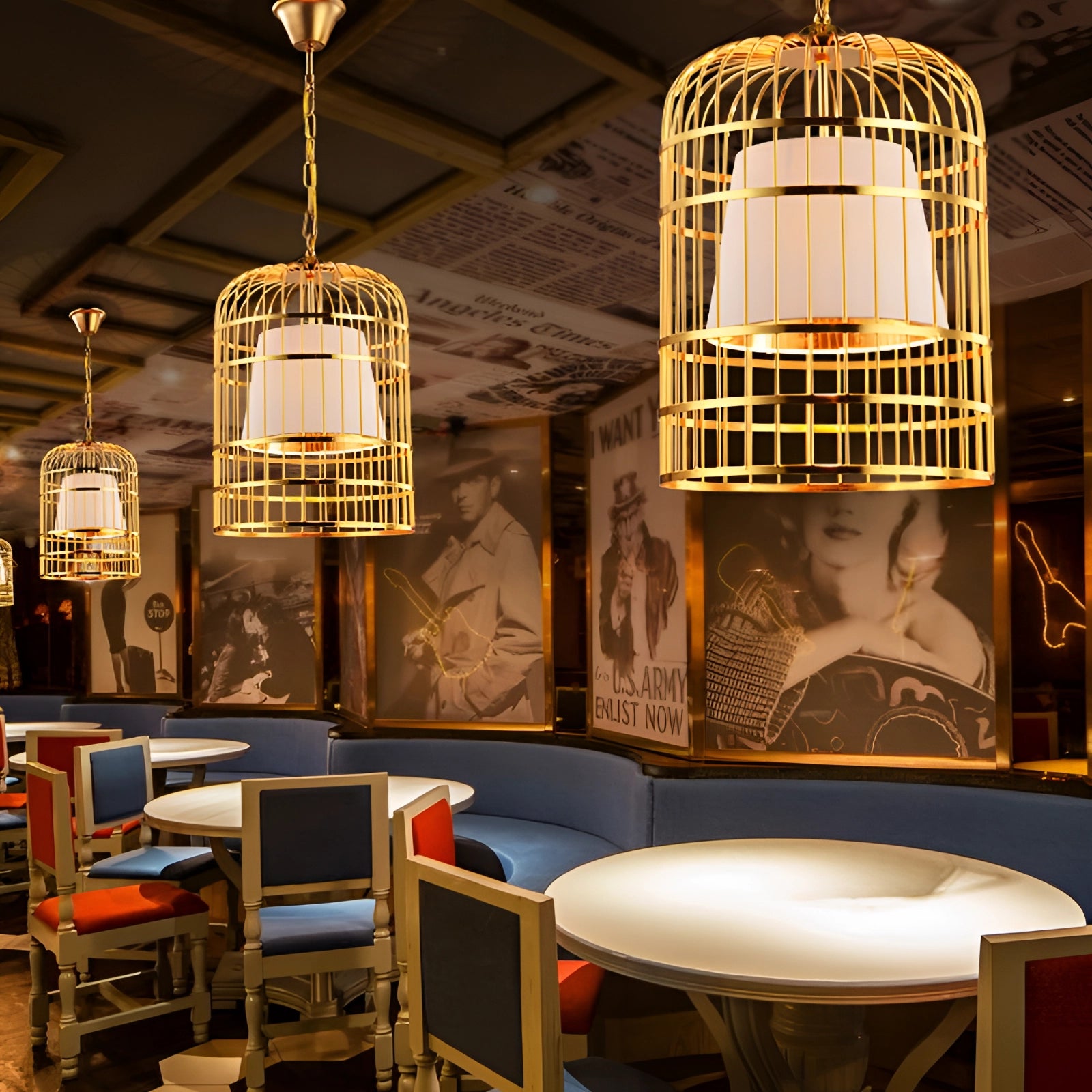 Gold birdcage chandelier with modern design hanging in a dining room, illuminating the space with warm yellow light.